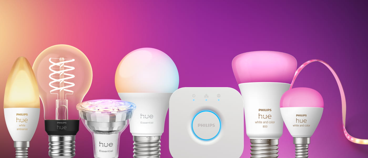 Philips Hue-lampor och LED-list i olika modeller, white och white and color, med Hue Bridge mot lila bakgrund