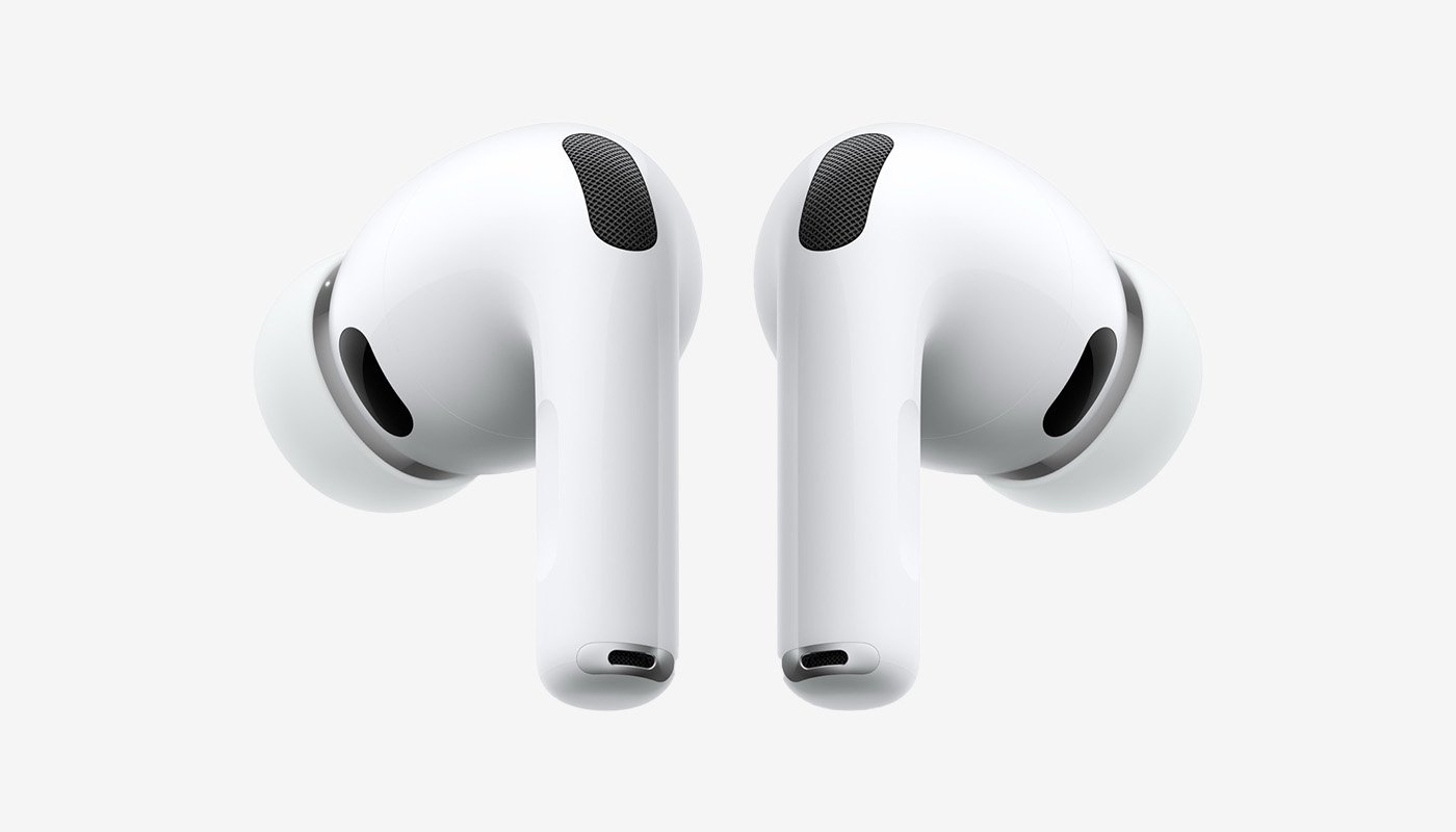 Ett par vita trådlösa hörlurar med silikontoppar och rundad design, visade framifrån med mikrofon- och högtalargaller.