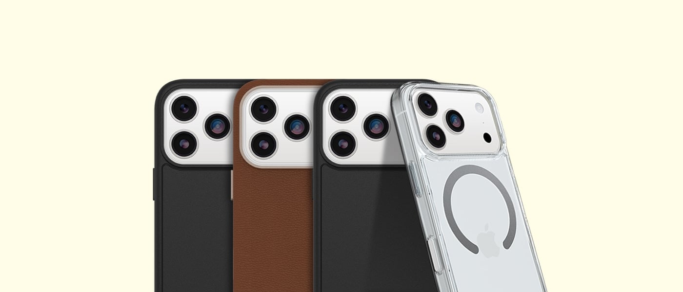 Fire iPhoner med ulike deksler: svart, brunt, svart med struktur og gjennomsiktig MagSafe-deksel med Apple-logo.