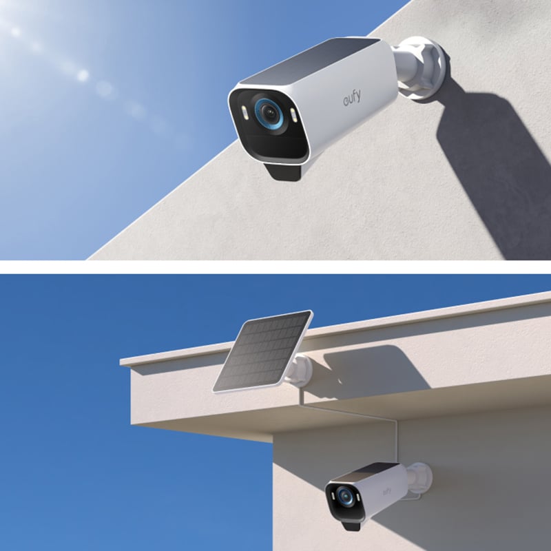 Vit Eufy-övervakningskamera monterad utomhus, i ena bilden med solpanel på taklist under klarblå himmel.
